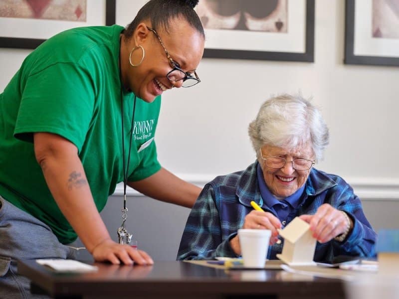 Known Memory Care | Resident craft with caregiver