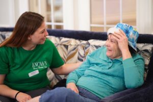 Known Memory Care | Team member talking with a resident